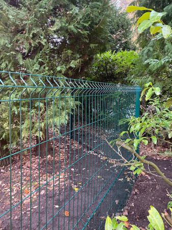 Wentworth Landscaping Green Metal Mesh Fence on Wooded Boundary