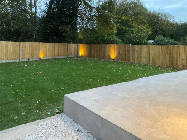 Wentworth Landscaping Porcelain Patio Raised Edge with Turfed Garden and Uplighting
