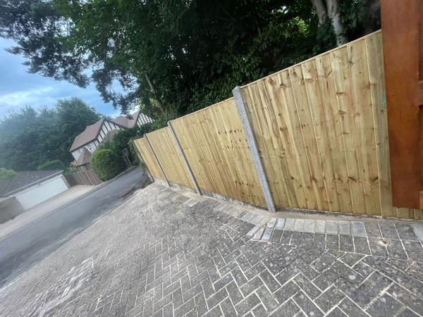Wentworth Landscaping Closeboard Fence with Block Paving Driveway on Slope