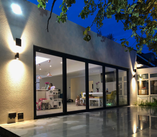 Wentworth Landscaping Porcelain Patio with Rendered Wall and Evening Lighting