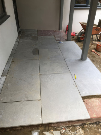 Wentworth Landscaping Grey Porcelain Patio Being Laid Under Pergola