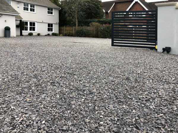 Wentworth Landscaping Gravel Driveway with Dark Slatted Electric Gate